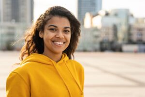 front-view-beautiful-girl-with-yellow-hoodie_23-2148768507