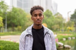 portrait-young-man-standing-outdoors_1048944-12807968