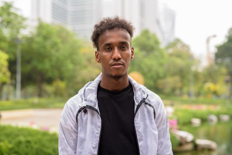 portrait-young-man-standing-outdoors_1048944-12807968